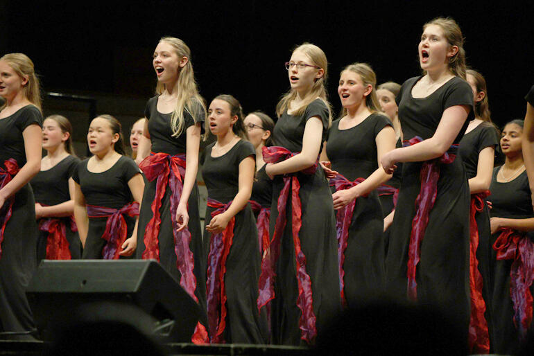 Bel Suono choristers from Waikato Diocesan School for Girls dial up the glamour in 'They Just Keep Moving the Line'.
