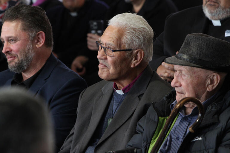Colin Bennett and Pīhopa Ngarahu Katene smile at a comment from one of the speakers.